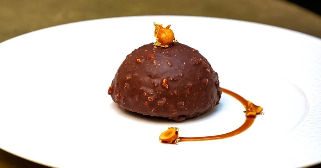 Vegan hazelnut dessert topped with chocolate, crafted at Le Basque vegan restaurant in NYC